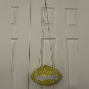 Bedazzled football shaped shoulder bag. Can fit cell phone and much more!